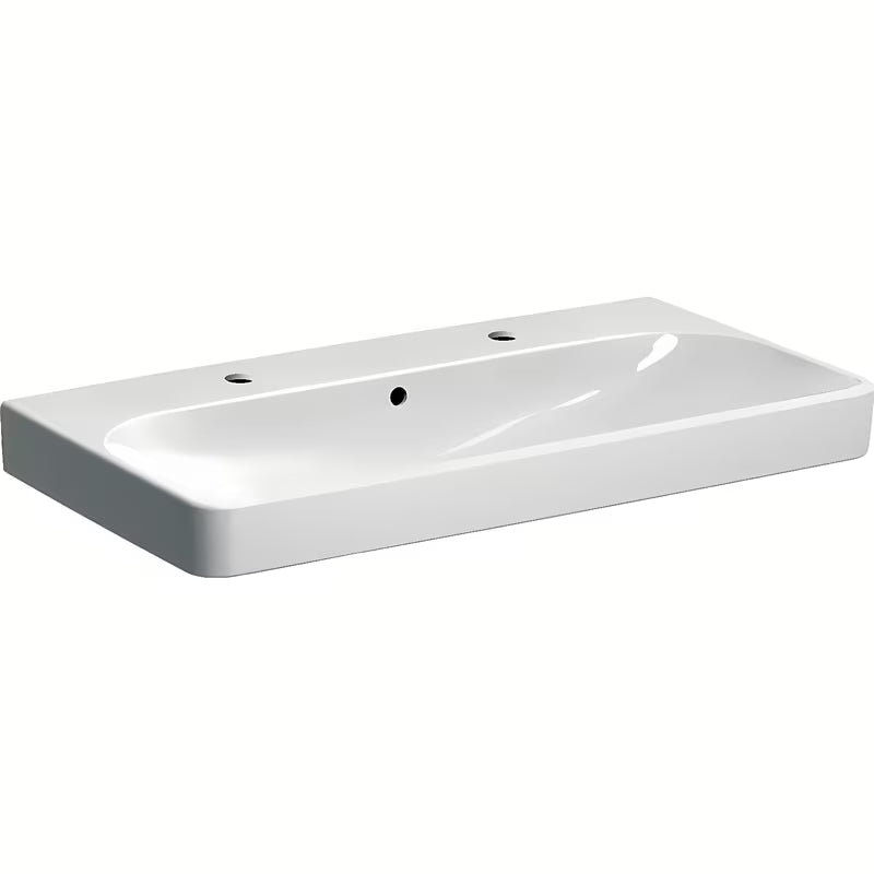 Biała umywalka wisząca Geberit Smyle Square 90x48 cm z ceramiki sanitarnej z dwoma otworami pro baterię.