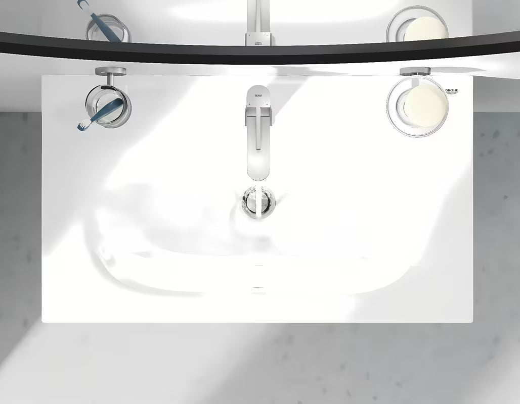 Bateria umywalkowa jednouchwytowa Grohe Plus w wykończeniu supersteel z obrotową wylewką i zestawem odpływowym.