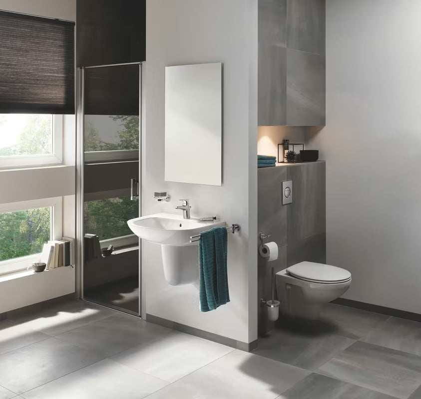 Chromowana jednouchwytowa bateria umywalkowa Grohe Start Flow z odpływem z oszczędnym przepływem 5,7 l/min