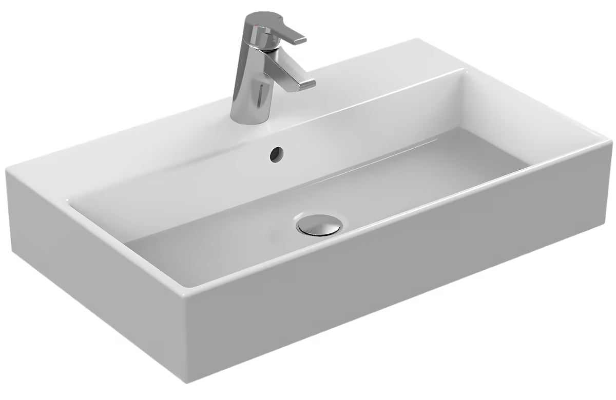 Biała ceramiczna umywalka wisząca Ideal Standard Strada 71x42 cm z otworem pro na baterię pośrodku.