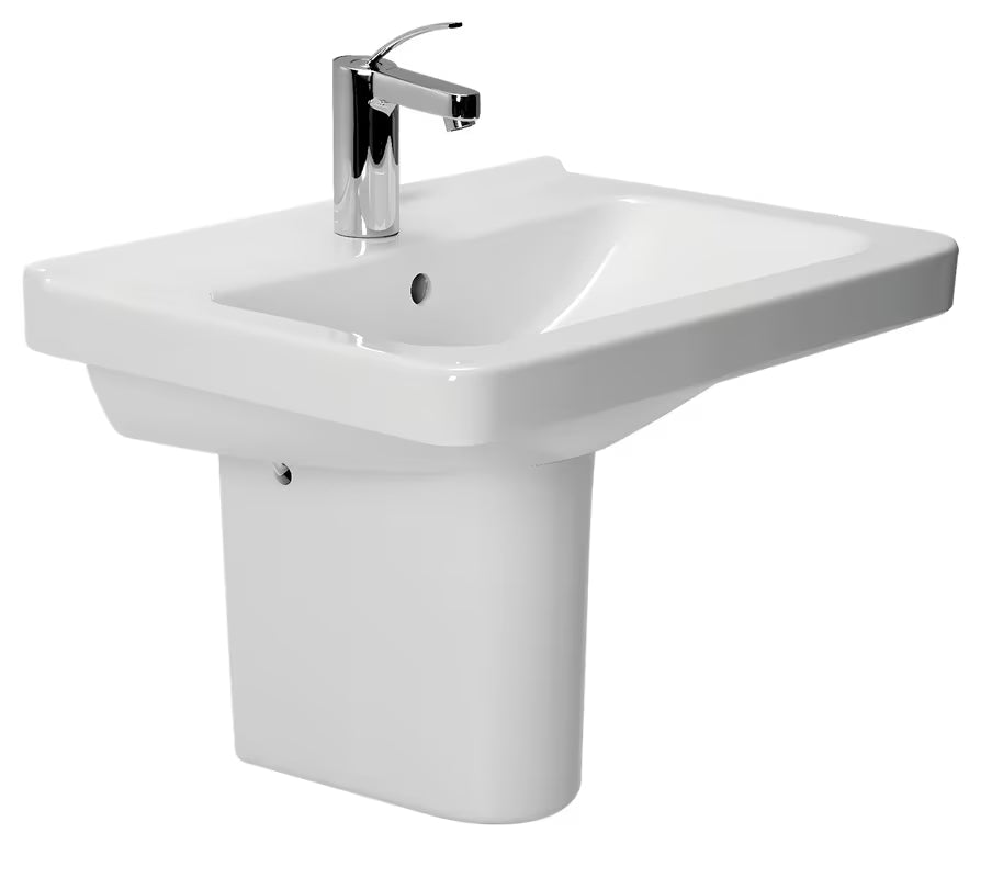 Ceramiczna umywalka wisząca Jika Cubito w kolorze białym, o prostokątnym kształcie, z otworem pro baterię pośrodku.