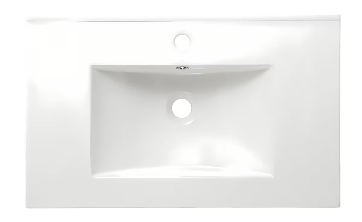 Biała ceramiczna umywalka meblowa Naturel Modena 61x46 cm z półką odkładczą i otworem pro na baterię pośrodku.