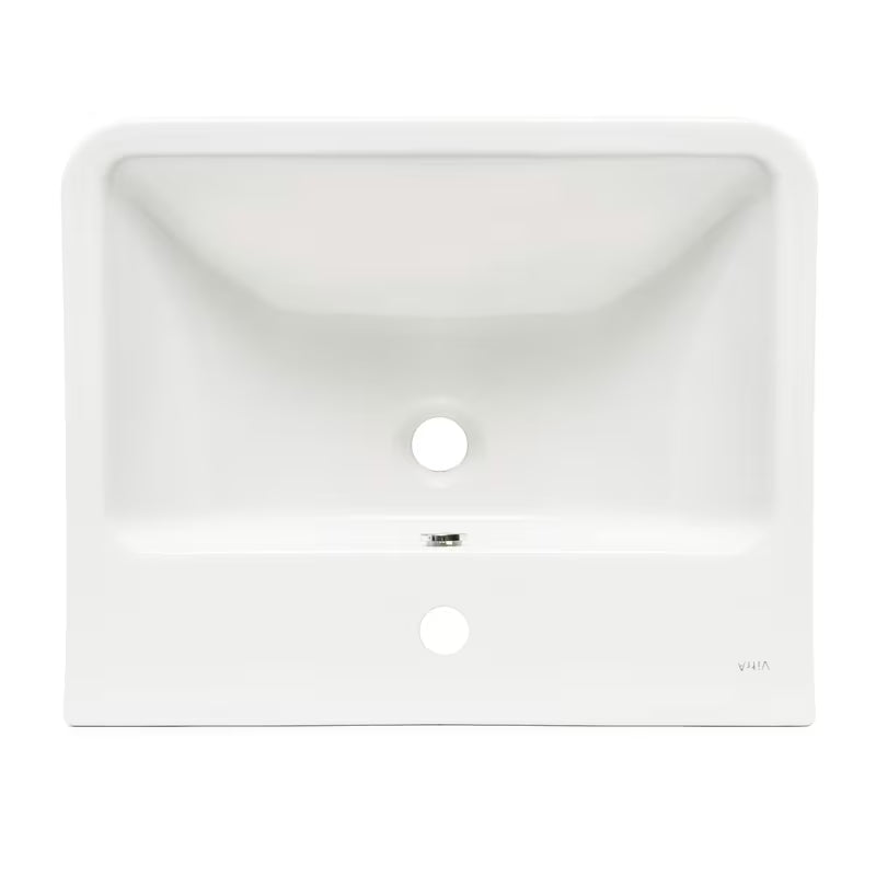 Biała ceramiczna umywalka wiszące vitra Integra 55x45 cm z otworem na baterię pośrodku i przelewem.