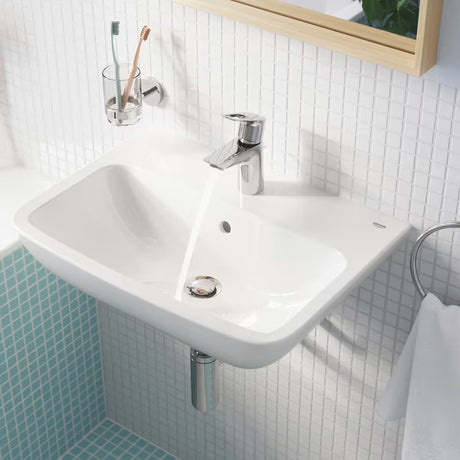 Chromowana jednouchwytowa stojąca bateria umywalkowa Grohe bauloop z odpływem