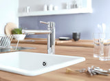 Chromowana bateria zlewozmywakowa Grohe Concetto New ze średnio wysoką obrotową wylewką i wyciąganą wylewką natryskową