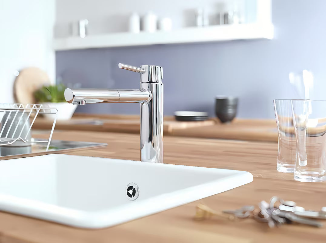 Chromowana bateria zlewozmywakowa Grohe Concetto New ze średnio wysoką obrotową wylewką i wyciąganą wylewką natryskową
