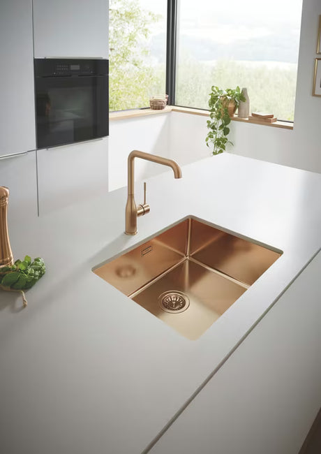 Grohe Essence New bateria zlewozmywakowa z wysoką obrotową wylewką w kolorze brushed warm sunset