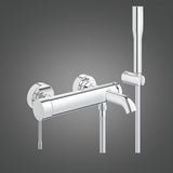 Chromowana ścienna bateria wannowa Grohe Essence New z zestawem prysznicowym