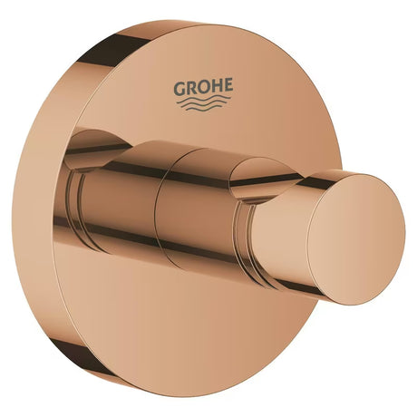 Haczyk na szlafrok Grohe Essentials w wykończeniu warm sunset z ukrytym mocowaniem i powłoką Grohe StarLight.