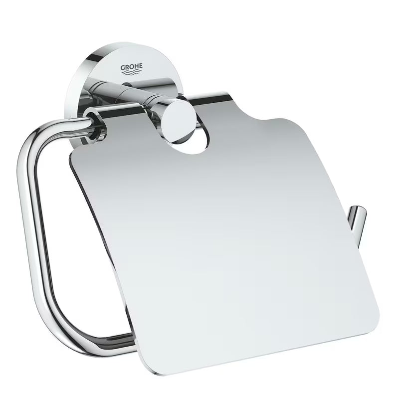 Chromowany uchwyt na papier toaletowy Grohe Essentials z pokrywą z ukrytym mocowaniem ściennym.