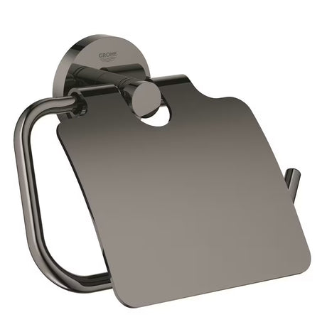 Uchwyt na papier Toaletowy Grohe Essentials z pokrywą w wykończeniu hard graphite z ukrytym mocowaniem.