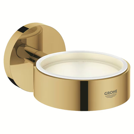 Metalowy uchwyt Grohe Essentials w wykończeniu Cool Sunrise pro szklankę, mydelniczkę lub dozownik.