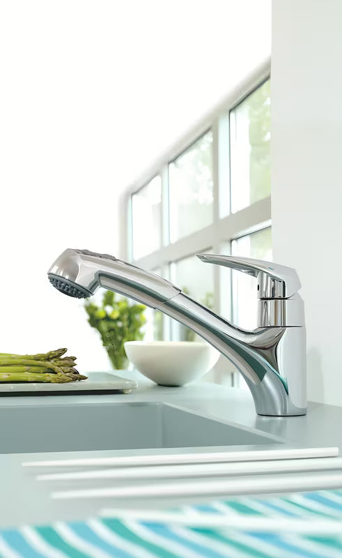 Chromowana bateria zlewozmywakowa Grohe Eurodisc z wyciąganą wylewką z obrotową wylewką