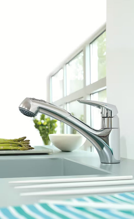 Chromowana bateria zlewozmywakowa Grohe Eurodisc z wyciąganą wylewką z obrotową wylewką