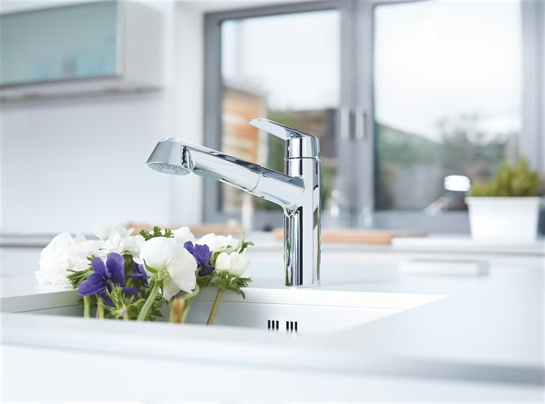 Chromowana bateria zlewozmywakowa Grohe Eurodisc Cosmopolitan z wyciąganą wylewką i obrotową wylewką