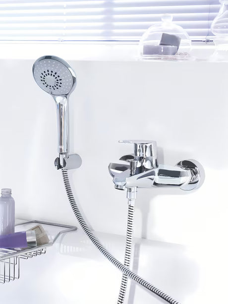 Chromowana ścienna bateria wannowa Grohe Eurodisc z zestawem prysznicowym