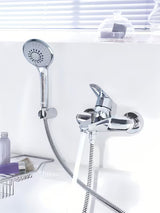 Chromowana ścienna bateria wannowa Grohe Eurodisc z zestawem prysznicowym