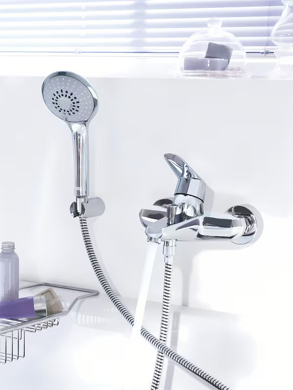 Chromowana ścienna bateria wannowa Grohe Eurodisc z zestawem prysznicowym