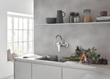 Grohe Eurosmart New jednouchwytowa ścienna bateria zlewozmywakowa w wykończeniu chrom z obrotowym ramieniem.