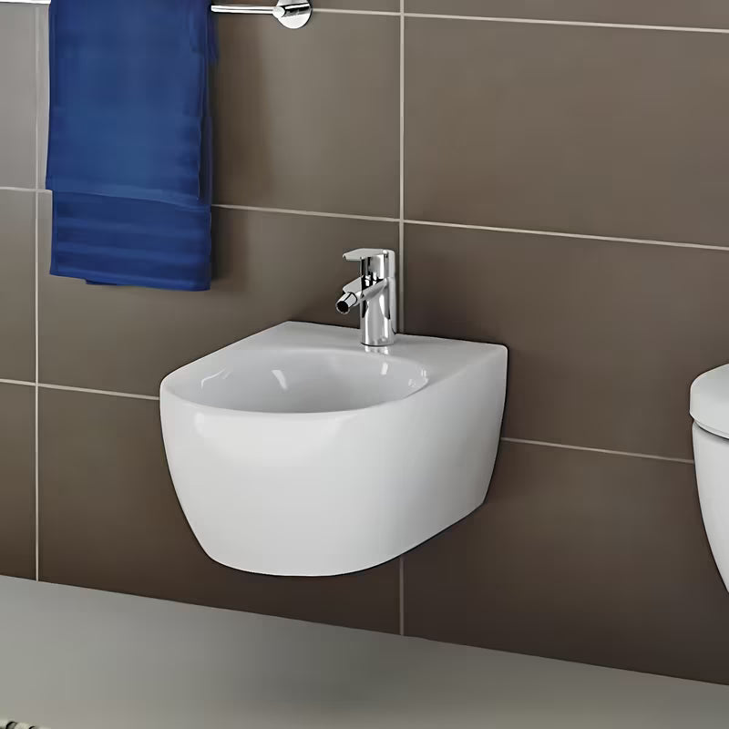 Chromowana bateria bidetowa Grohe Eurostyle Cosmopolitan z odpływem z sterowaniem dźwigniowym.