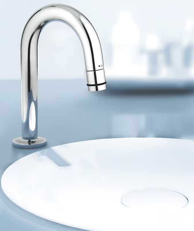 Chromowany zawór umywalkowy Grohe Universal z odpływem w kształcie C z funkcją start/stop