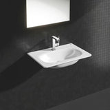 Chromowana jednouchwytowa bateria umywalkowa Grohe Plus z obrotową wylewką i zestawem odpływowym