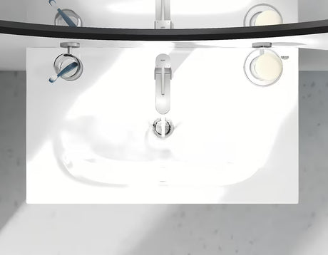Bateria umywalkowa jednouchwytowa Grohe Plus w wykończeniu supersteel z obrotową wylewką i zestawem odpływowym.