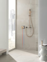 Drążek prysznicowy Grohe Rainshower smartactive 900 mm z półką w wykończeniu brushed warm sunset