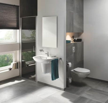 Chromowana jednouchwytowa bateria umywalkowa Grohe Start Flow z odpływem z oszczędnym przepływem 5,7 l/min