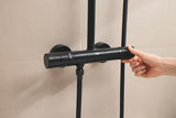 Matowo czarny system prysznicowy Grohe Tempesta System Cube z baterią termostatyczną, z deszczownicą i słuchawką prysznicową