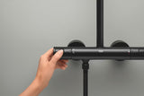Matowo czarny system prysznicowy Grohe Vitalio Comfort 250 z baterią termostatyczną, z deszczownicą i słuchawką prysznicową