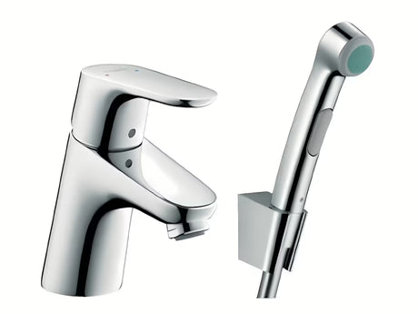 Chromowana jednouchwytowa bateria umywalkowa Hansgrohe Focus z prysznicem bidetowym Bidette i wężem prysznicowym