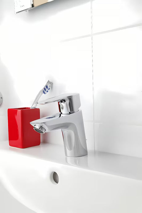 Chromowa jednouchwytowa stojąca bateria umywalkowa Hansgrohe HG248 z odpływem
