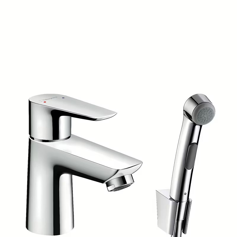 Chromowana jednouchwytowa bateria umywalkowa Hansgrohe Talis E z prysznicem bidetowym i korkiem Push-Open.
