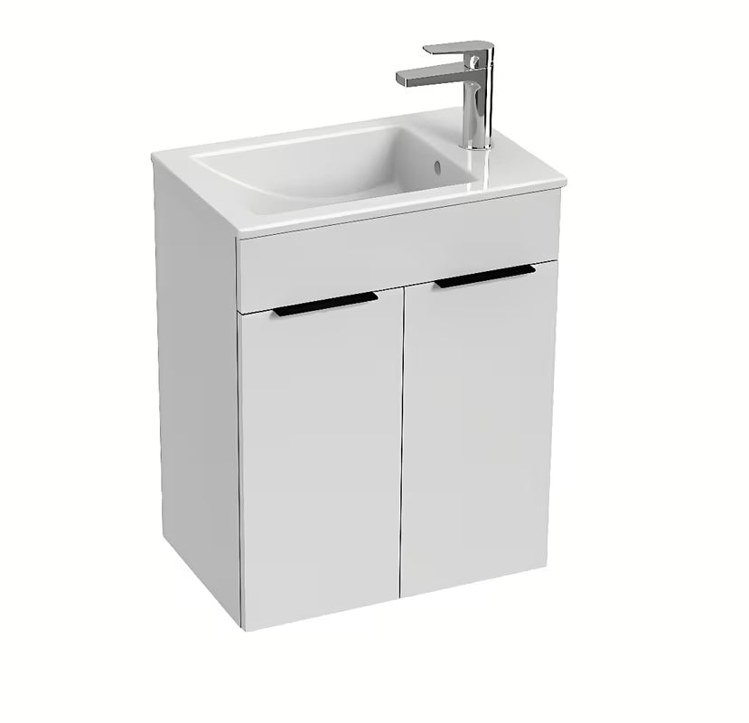 Biała szafka wisząca Jika Cube z dwojgiem drzwi i ceramiczną umywalką.
