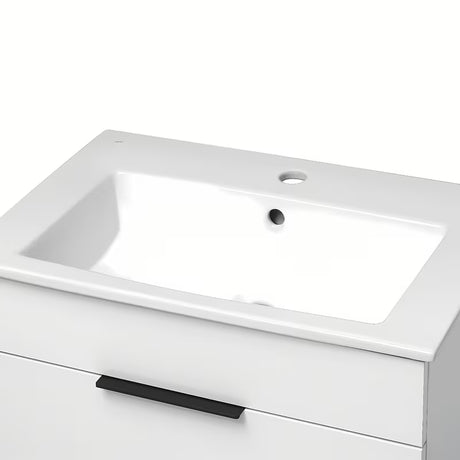 Biała szafka wisząca Jika Plan z umywalką ceramiczną i szufladami z pełnym wysuwem.