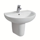 Owalna wiszące biała ceramiczna umywalka Kolo Rekord z otworem pro na baterię pośrodku.