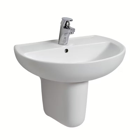 Owalna wiszące biała ceramiczna umywalka Kolo Rekord z otworem pro na baterię pośrodku.