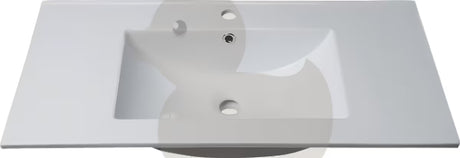 Biała ceramiczna umywalka meblowa Naturel Modena 61x46 cm z półką odkładczą i otworem pro na baterię pośrodku.