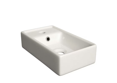 Biała ceramiczna umywalka meblowa Naturel Stilla 40x22 cm z otworem pro na baterię i otwartym przelewem.