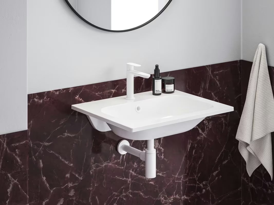 Biała umywalka meblowa Ravak Chrome Slim 60 x 49 cm z lanego marmuru z przelewem