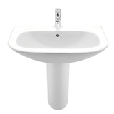 Biała wiszące ceramiczna umywalka Roca Nexo z przelewem i otworem na baterię pośrodku