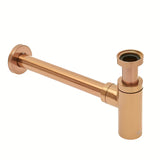 Mosiężny syfon umywalkowy SAT Aurum w kolorze rose gold, o okrągłym kształcie i średnicy 32 mm.
