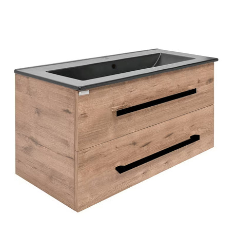 Wisząca szafka łazienkowa SAT Cube Way z umywalką ceramiczną w dekorze dąb Wellington i czarnymi uchwytami.