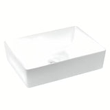 Biała prostokątna umywalka nablatowa  Triomini Slim z cienkościennej ceramiki, 55 x 39 cm