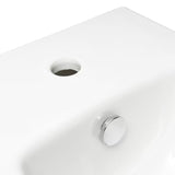 Biały wiszący bidet Vitra Integra z otworem na baterię i przelewem