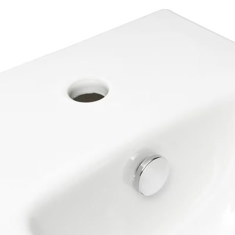Biały wiszący bidet Vitra Integra z otworem na baterię i przelewem