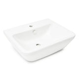 Biała ceramiczna umywalka wiszące vitra Integra 55x45 cm z otworem na baterię pośrodku i przelewem.