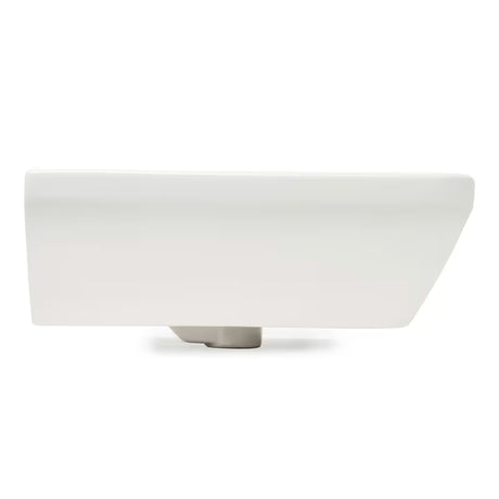 Biała ceramiczna umywalka wiszące vitra Integra 55x45 cm z otworem na baterię pośrodku i przelewem.